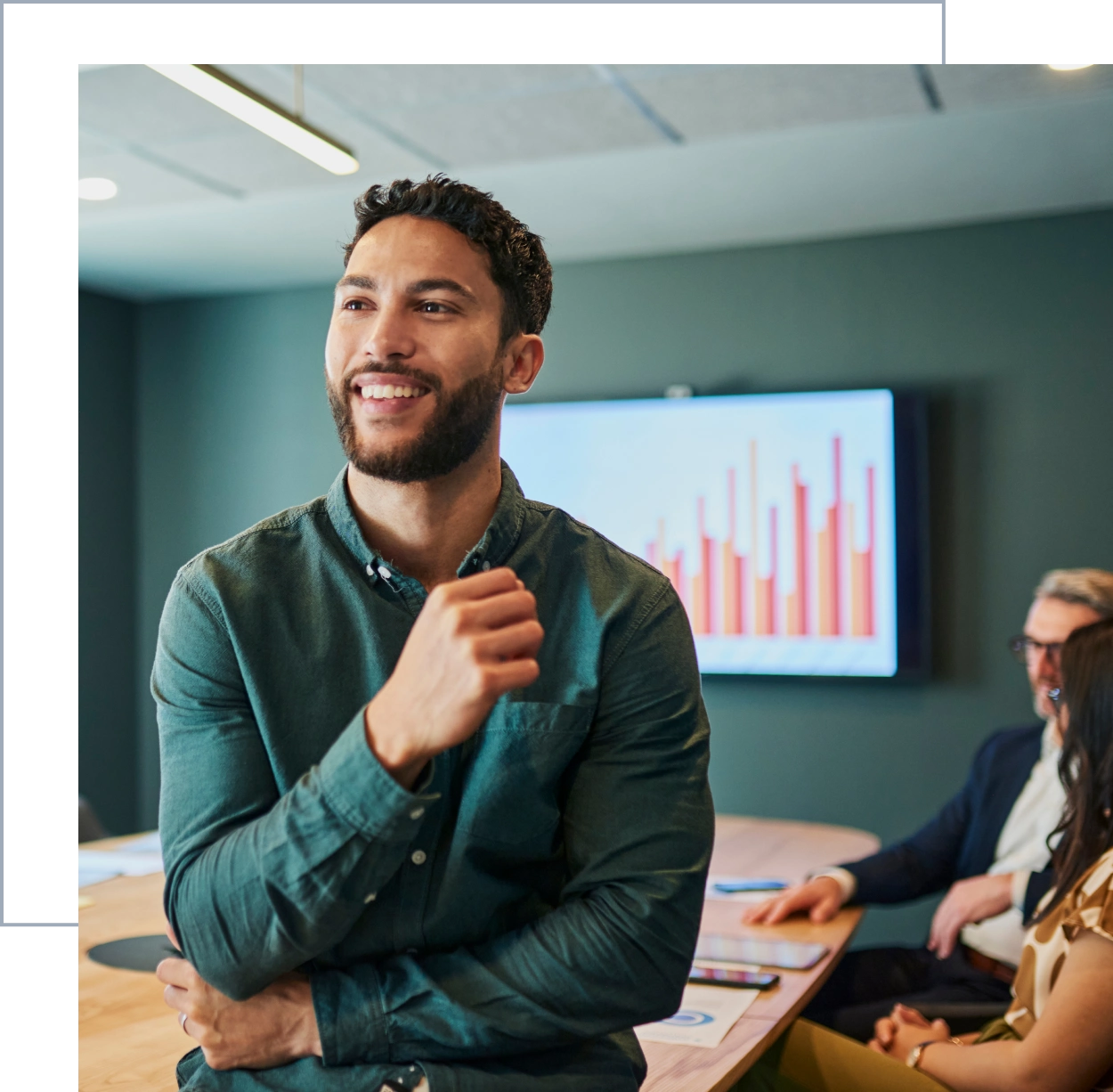 Man presenting in a business meeting room.